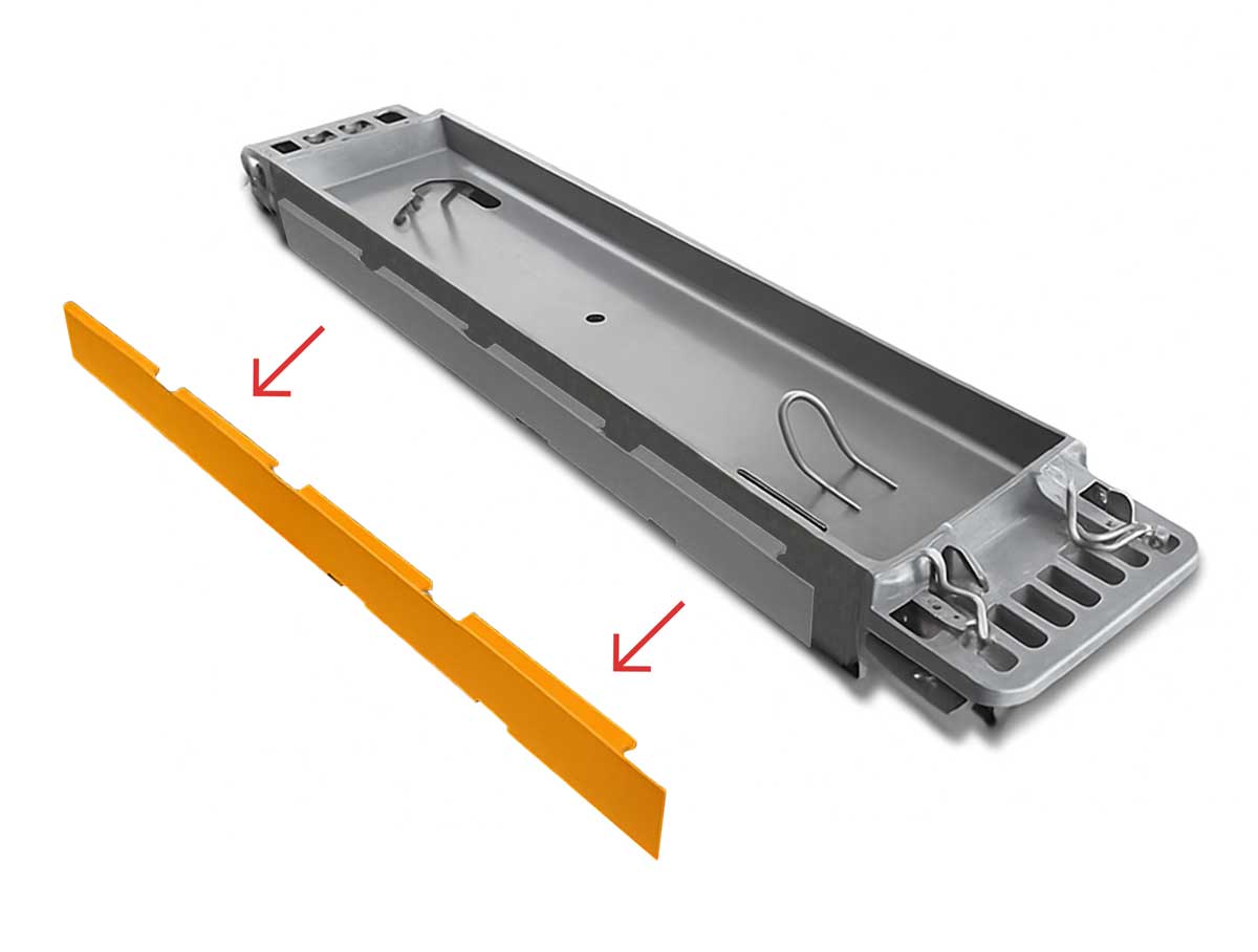Steel coil transport tray with yellow polyurethane liners manufactured by Universal Urethane Products for safe and stable coil handling.